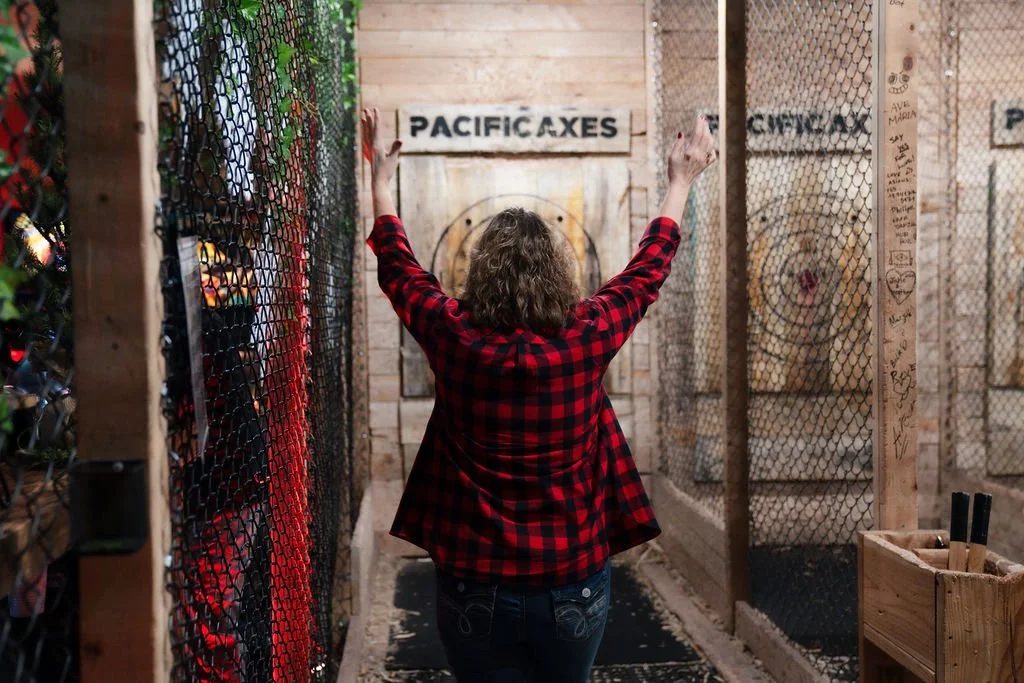 Member celebrating a throw at Pacific Axes