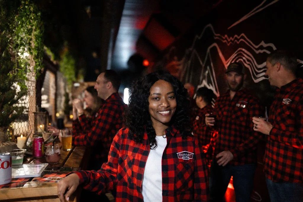 Guests in plaid shirts at the Pacific Axes bar