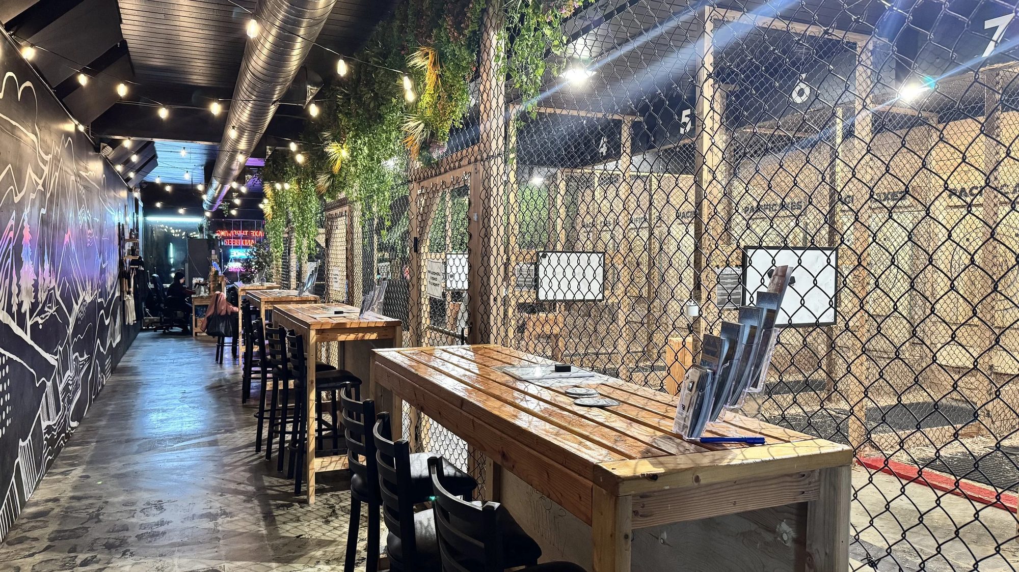 Sports bar seating with tables and string lights